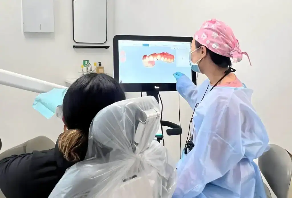 Dr. Kim showing patients smile on iTeron in Burlingame, CA
